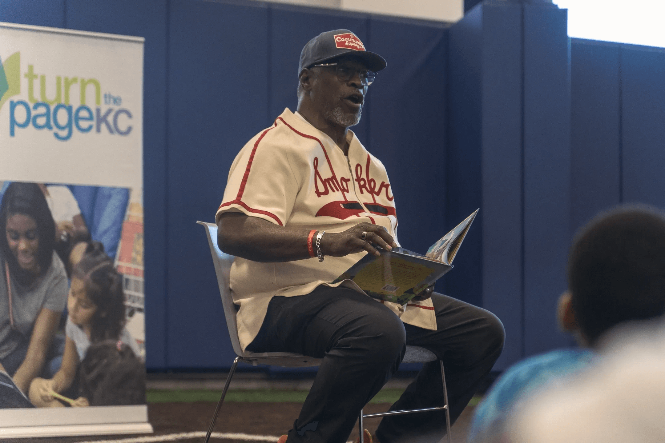 Guest reader sharing literacy with children